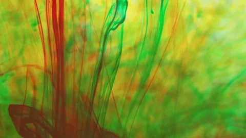 Multicolored inks spreading in water, forming whimsical patterns Video stock 246848234