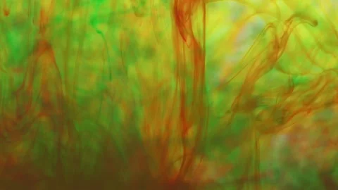 Multicolored inks spreading in water, forming whimsical patterns Video stock 246848414