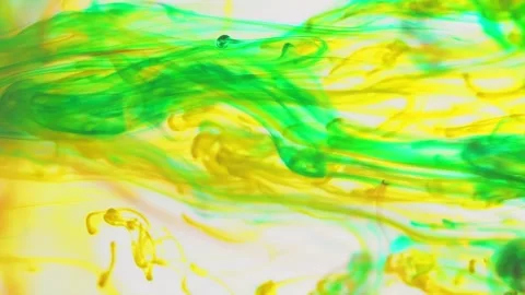Multicolored inks spreading in water, forming whimsical patterns and iridescent Video stock 247332846