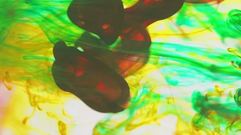 Multicolored inks spreading in water, forming whimsical patterns and iridescent 動画素材 247332881