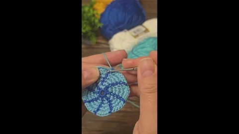 Multicolored knitted fabric, handmade. Knitting and crochet lessons. Fashion Stock Footage 340607051