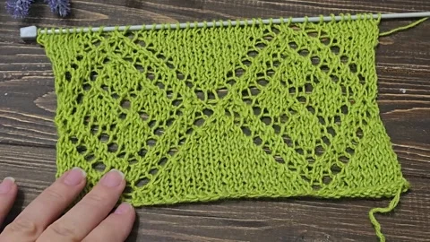 Multicolored knitted fabric, handmade. Knitting and crochet lessons. Fashion Stock Footage 340607481