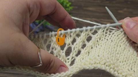 Multicolored knitted fabric, handmade. Knitting and crochet lessons. Fashion Stock Footage 340607673
