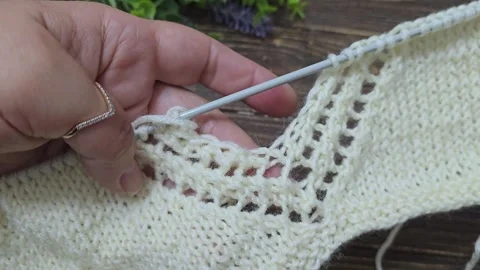 Multicolored knitted fabric, handmade. Knitting and crochet lessons. Fashion Stock Footage 340607704