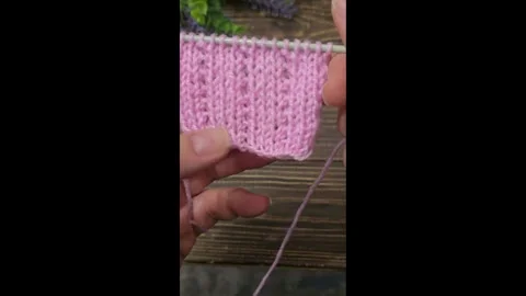Multicolored knitted fabric, handmade. Knitting and crochet lessons. Fashion Stock Footage 340607805