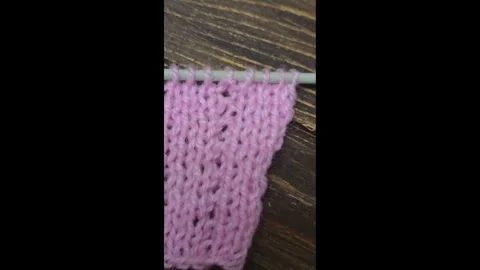 Multicolored knitted fabric, handmade. Knitting and crochet lessons. Fashion Stock Footage 340607815