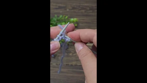 Multicolored knitted fabric, handmade. Knitting and crochet lessons. Fashion Stock Footage 340607911