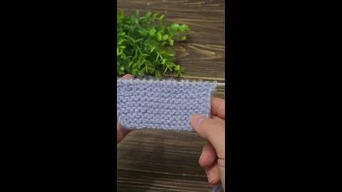 Multicolored knitted fabric, handmade. Knitting and crochet lessons. Fashion Stock Footage 340607930