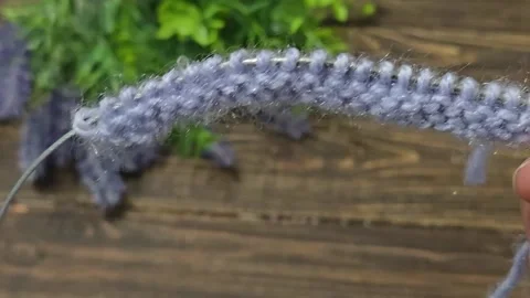 Multicolored knitted fabric, handmade. Knitting and crochet lessons. Fashion Stock Footage 340608030