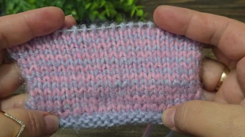 Multicolored knitted fabric, handmade. Knitting and crochet lessons. Fashion Stock Footage 340608130