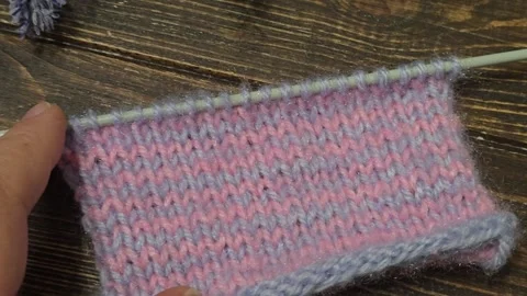 Multicolored knitted fabric, handmade. Knitting and crochet lessons. Fashion Stock Footage 340608145