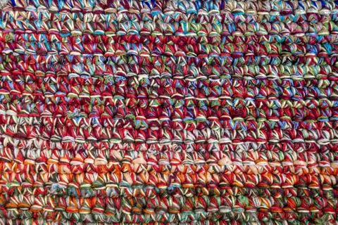 Multicolored knitted textile fabric pattern with vibrant woven yarn detail 写真素材