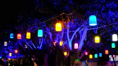 Multicolored lanterns hang in cafe or restaurant above summer terrace among Stock Footage 165907754