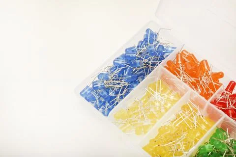 Multicolored LEDs in a plastic box. Semiconductor diodes. Electronic compon.. Stock Photos