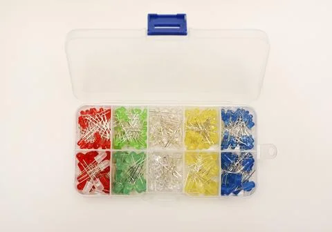 Multicolored LEDs in a plastic box on a white background. LED radio elements. Stock Photos