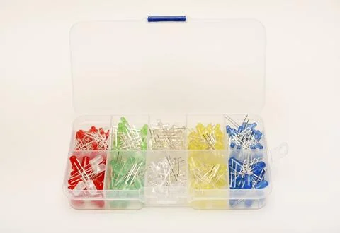 Multicolored LEDs in a plastic box on a white background. LED radio elements. Stock Photos