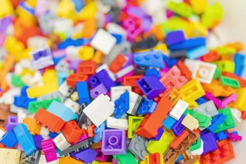 Multicolored lego bricks close-up partial focus. Stock Photos