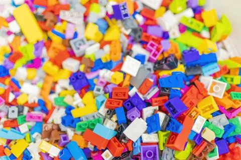 Multicolored lego bricks close-up partial focus. Stock Photos