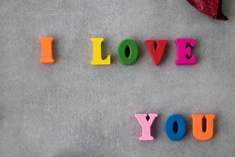 Multicolored letters on gray background. I love you. Valentine's Day Concept. Stock Photos