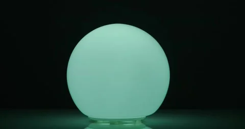 Multicolored light ball on a dark background Stock Footage 227042091