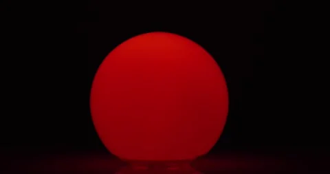 Multicolored light ball on a dark background Stock Footage 227042486