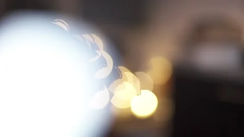 Multicolored light on a black background. Bokeh effect of natural light lamp Stock Footage 239530890