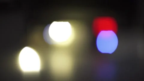 Multicolored light on a black background. Bokeh effect of natural light lamp Stock Footage 239531228