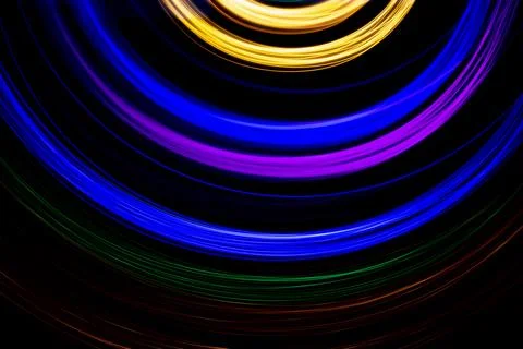 Multicolored light on a black background Stock Photos