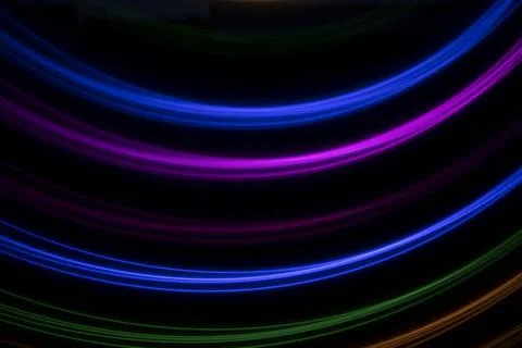 Multicolored light on a black background Stock Photos