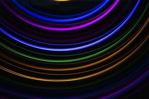 Multicolored light on a black background Stock Photos
