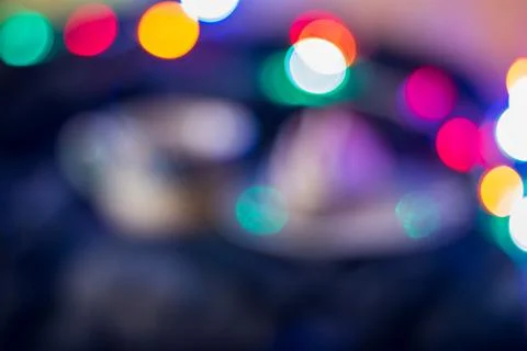 Multicolored lights on a dark background Stock Photos