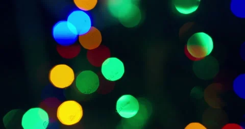 Multicolored lights flicker on a dark background. Close-up Stock Footage 146770616