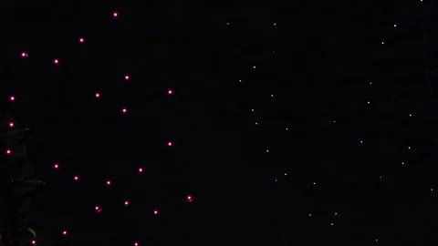 Multicolored lights light up and go out on dark background. Stock Footage 291010568