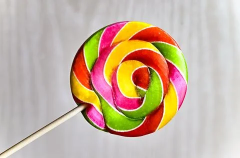Multicolored lollipop on a light background. Stock Photos