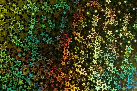 Multicolored luminous star outlines pattern on dark shimmering background Stock Photos