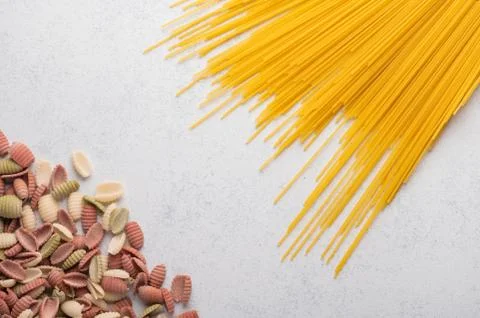 Multicolored macaroni spaghetti background concept close up. Diet and healthy Stock Photos