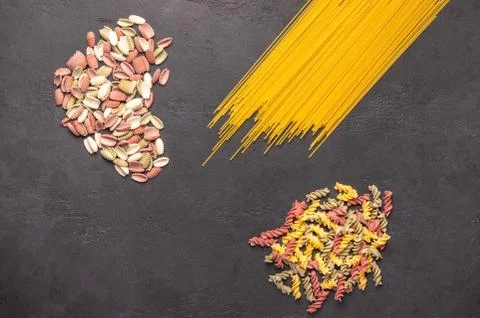 Multicolored macaroni spaghetti background concept close up. Diet and healthy Stock Photos