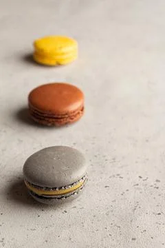 Multicolored macarons macaroon on a light gray background Stock Photos