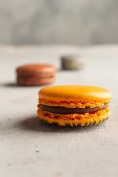 Multicolored macarons macaroon on a light gray background Stock Photos