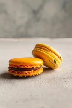 Multicolored macarons macaroon on a light gray background Stock Photos