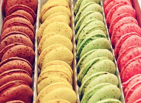 Multicolored macarons in a paper box Stock Photos