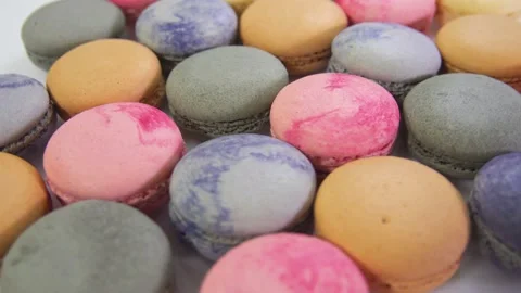 Multicolored macarons, rotate on its axis on a white background. Stock Footage 165564915