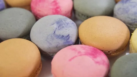 Multicolored macarons, rotate on its axis on a white background. Stock Footage 165566269
