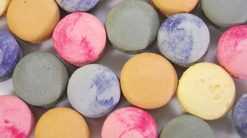 Multicolored macarons, rotate on its axis on a white background. Stock Footage 165566273