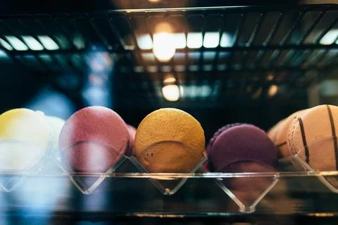 Multicolored macarons on a showcase in a cafe 스톡 사진