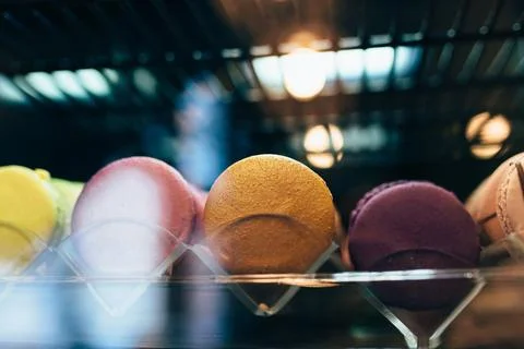 Multicolored macarons on a showcase in a cafe 스톡 사진