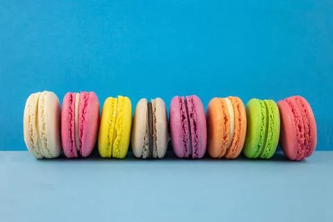 Multicolored macaroons on a blue background Stock-Fotos