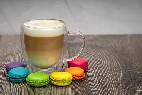 Multicolored macaroons in the colors of the LGBT rainbow flag and a transpare Stock Photos