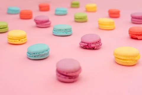 Multicolored macaroons on pink background Stock Photos