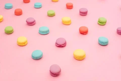 Multicolored macaroons on pink background Stock Photos